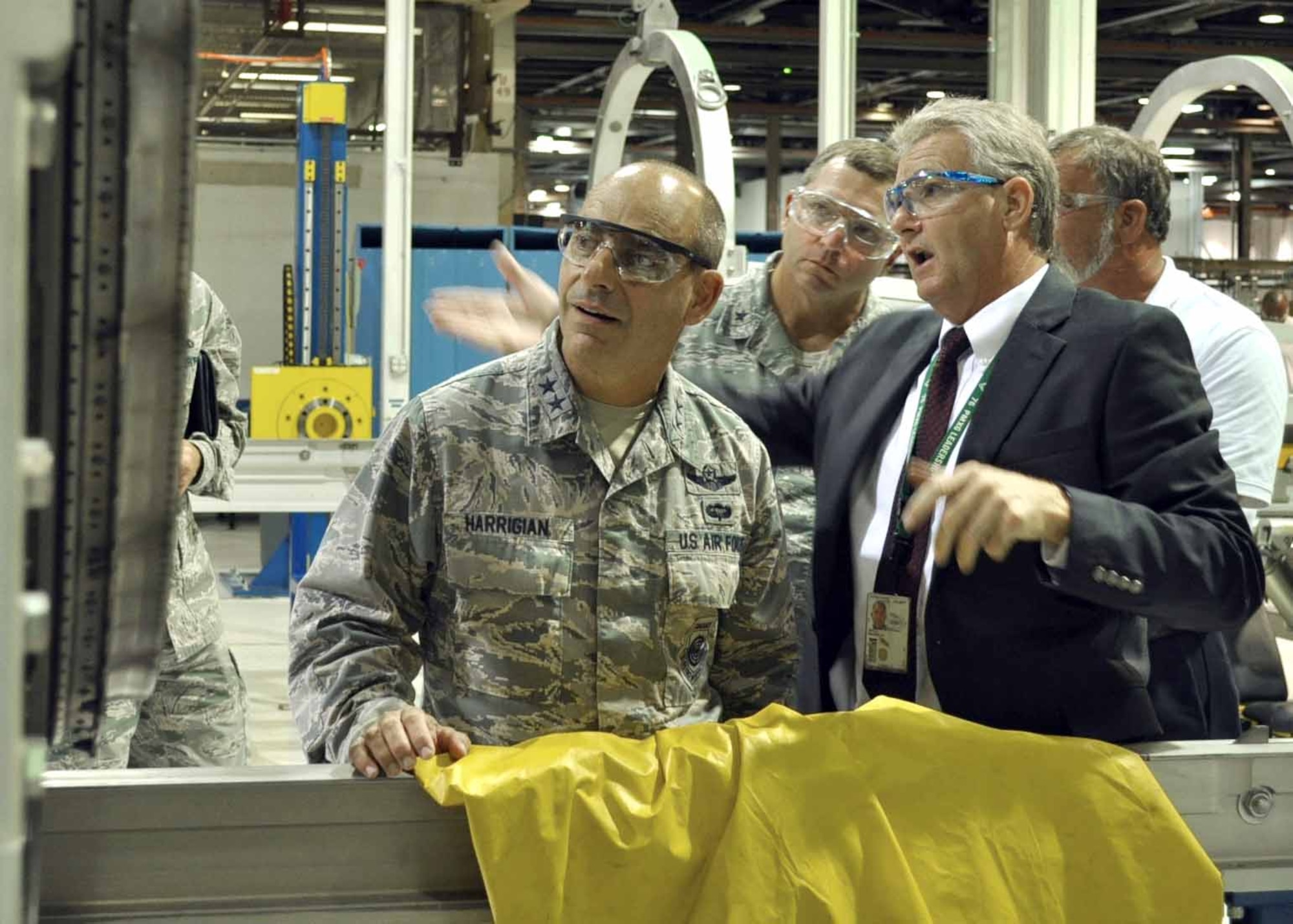 Mike Opela, the 544th Propulsion Maintenance Squadron director, discusses the process of modifying a Marine short take off and vertical landing F135 engine with Maj. Gen. Jeffrey L. Harrigian, the director of the F-35 Integration Office, Headquarters Air Force, during a visit to the Air Force Sustainment Center and Oklahoma City Air Logistics Complex where the modification is performed. (U.S. Air Force photo/Marlin Zimmerman) 