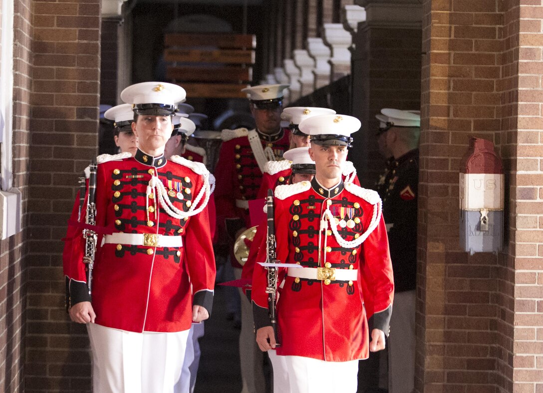 Members of the U.S. Marine Band conduct the opening performance for the Friday evening parade, Marine Barracks Washington, D.C., July 10, 2015. Gen. Joseph Dunford Jr., commandant of the Marine Corps, was the hosting official for the parade, and the Guests of Honor were eight congressional Marines, to include Sen. Charles Roberts, Sen. Daniel Sullivan, Rep. John Kline, Rep. Michael Coffman, Rep. Scott Rigell, Rep. Paul Cook, Rep. Mike Bost and Rep. Ruben Gallego. (U.S. Marine Corps photo by Cpl. Skye Davis/Released)