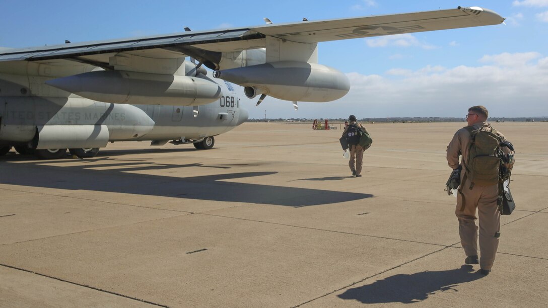 Marines with Marine Aerial Refueler Transport Squadron (VMGR) 352 walk to a KC-130J Super Hercules in preparation for a parachute drop at Marine Corps Air Station Miramar, California, July 8. Marines with VMGR-352 supported 1st Radio Battalion, I Marine Expeditionary Force. 