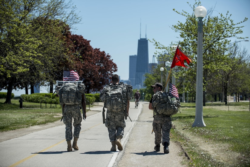 Three Army Reserve Soldiers from the 317th Engineer Company march along the Lakefront Trail, roughly 18 miles into the Chicago Honor the Fallen Ruck March. Approximately 450 military veterans, service members and supporters gathered for a 22-mile ruck march on May 22, just days before Memorial Day, to honor military men and women who suffer from Post-Traumatic Stress Disorder or have committed suicide. (U.S. Army photo by Sgt. 1st Class Michel Sauret)