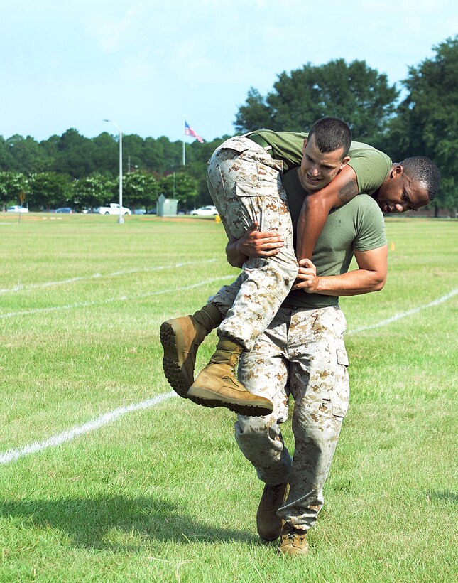 Marines test their resiliency during Marine Corps Logistics Base Albany's first High Intensity Tactical Training tactical athlete competition at Boyett Park here, July 14.