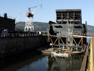 Workers at Swan Island near Portland, Ore., prepare the spillway weir Feb. 16 for movement up the lower Columbia River to Ice Harbor Lock and Dam on the lower Snake River. It took three days to transport the five-story-tall, 1.7 million-pound fish passage structure.