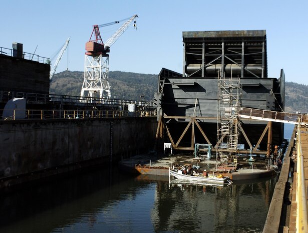 Workers at Swan Island near Portland, Ore., prepare the spillway weir Feb. 16 for movement up the lower Columbia River to Ice Harbor Lock and Dam on the lower Snake River. It took three days to transport the five-story-tall, 1.7 million-pound fish passage structure.