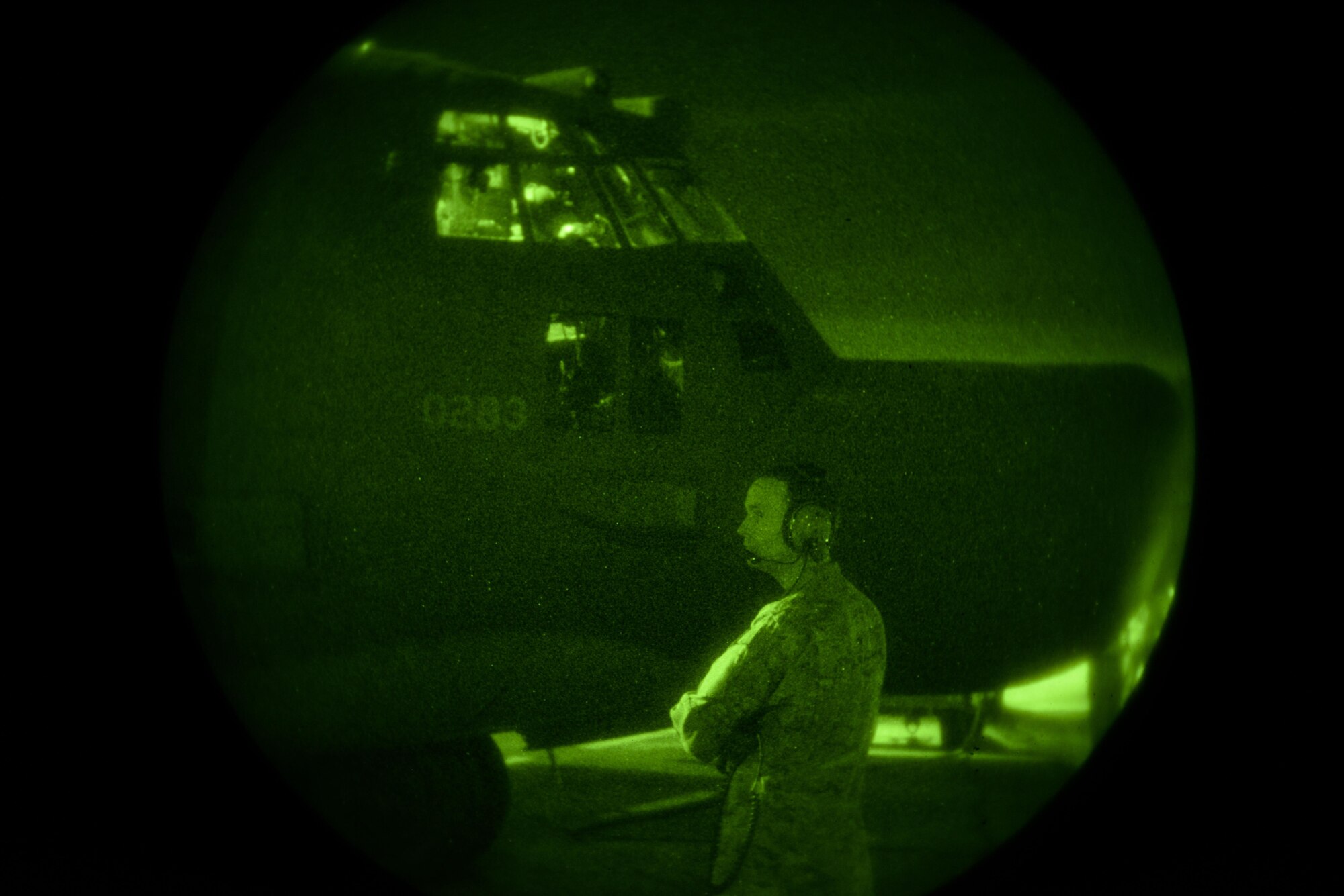 U.S. Air Force Master Sgt. Patrick Lehman, 1st Special Operations Squadron loadmaster, communicates with the pilots of an MC-130H Combat Tallon II as they get ready for takeoff in the Northern Territory of Australia, July 1, 2015. Talisman Sabre provides an opportunity to conduct operations in a combined, joint and interagency environment. (U.S. Air Force photo by Senior Airman Stephen G. Eigel)