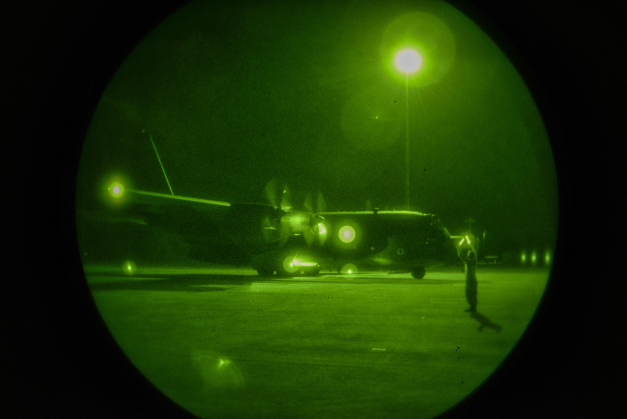 A crew chief from the 353rd Special Operations Maintenance Squadron marshals an MC-130H Combat Tallon II as they get ready for takeoff in the Northern Territory of Australia, July 1, 2015. Exercises such as Talisman Sabre 2015 provide realistic, relevant training which is necessary to maintain regional security, peace and stability. (U.S. Air Force photo by Senior Airman Stephen G. Eigel)