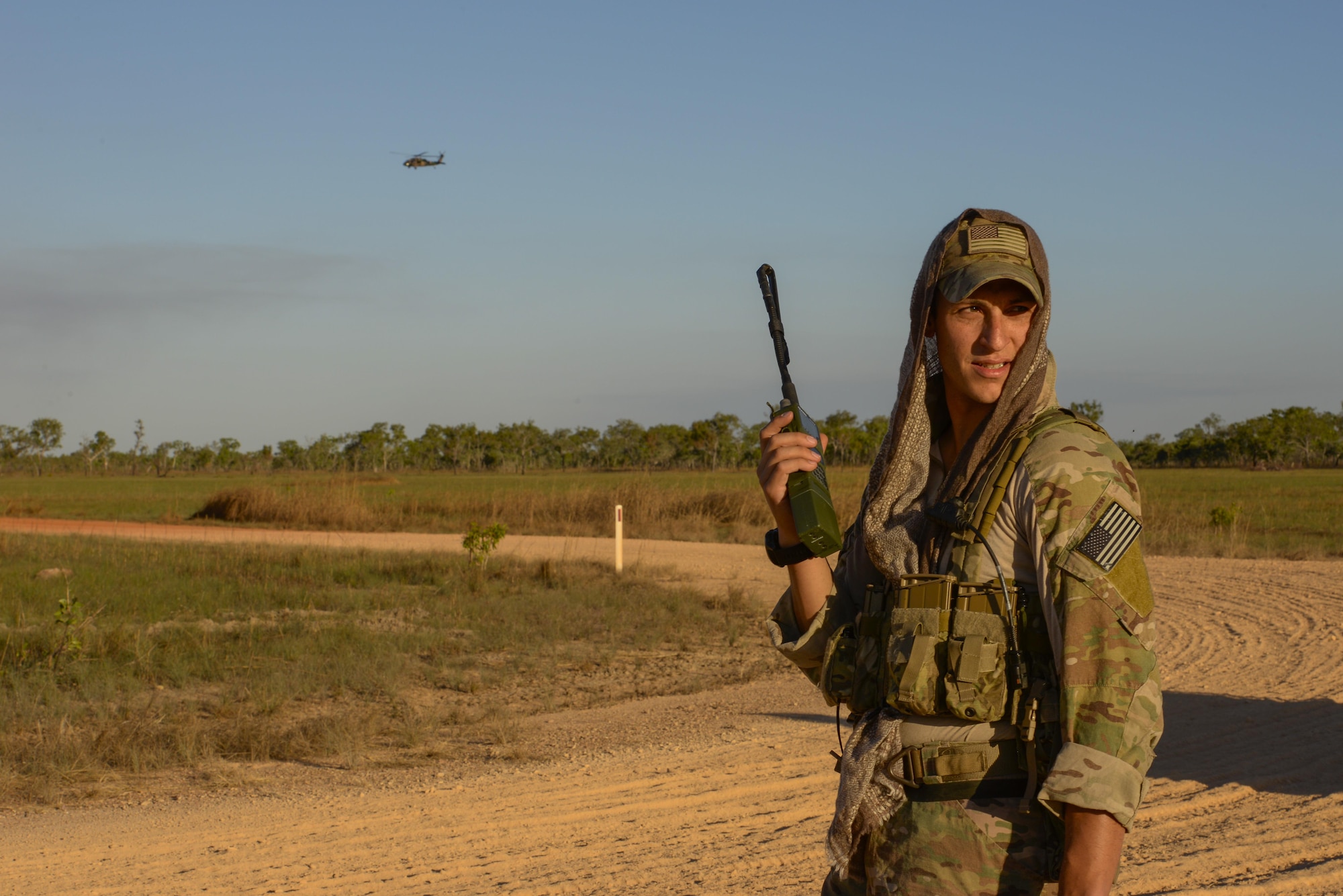 A U.S. Air Force combat controller from the 320th Special Tactics Squadron calls in an Australian army S-70A Black Hawk during exercise Talisman Sabre in the Northern Territory of Australia June 29, 2015. Talisman Sabre, jointly sponsored by the U.S. Pacific Command and Australian Defence Force Headquarters, Joint Operations Command, will incorporate U.S. Army, Navy, Marine Corps and Air Force and the Royal Australian Navy, Australian army and Royal Australian Air Force, as well as other government agencies from each country. (U.S. Air Force photo by Senior Airman Stephen G. Eigel)