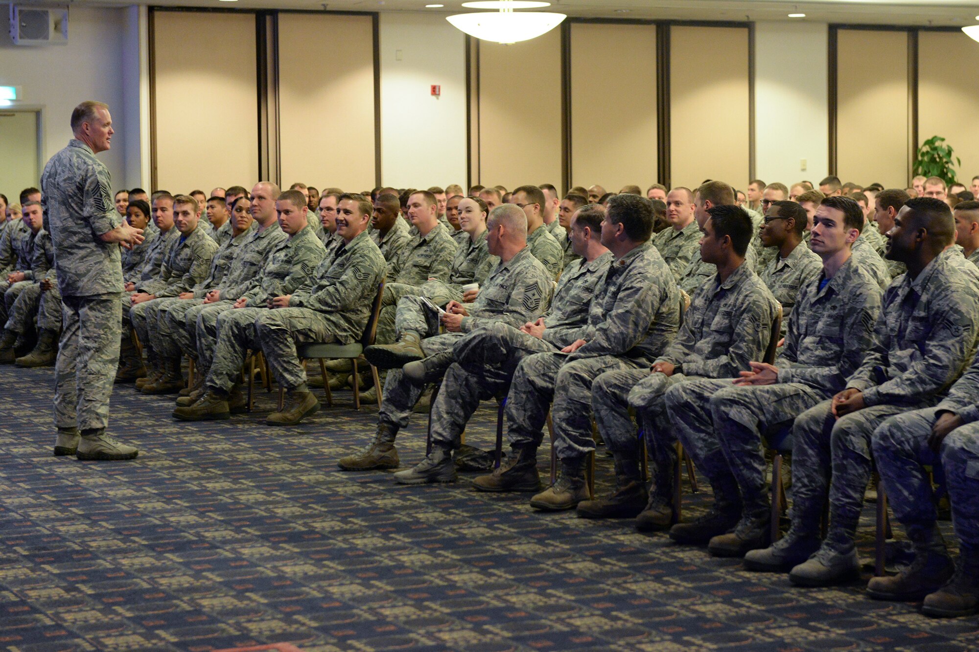 Chief Master Sergeant of the Air Force James Cody addresses questions from Airmen during an enlisted all-call at Yokota Air Base, Japan, July 10, 2015. Cody spent an hour and a half answering questions on a variety of topics, including the new enlisted performance report system and physical fitness standards. (U.S. Air Force photo by Airman 1st Class Elizabeth Baker/Released)