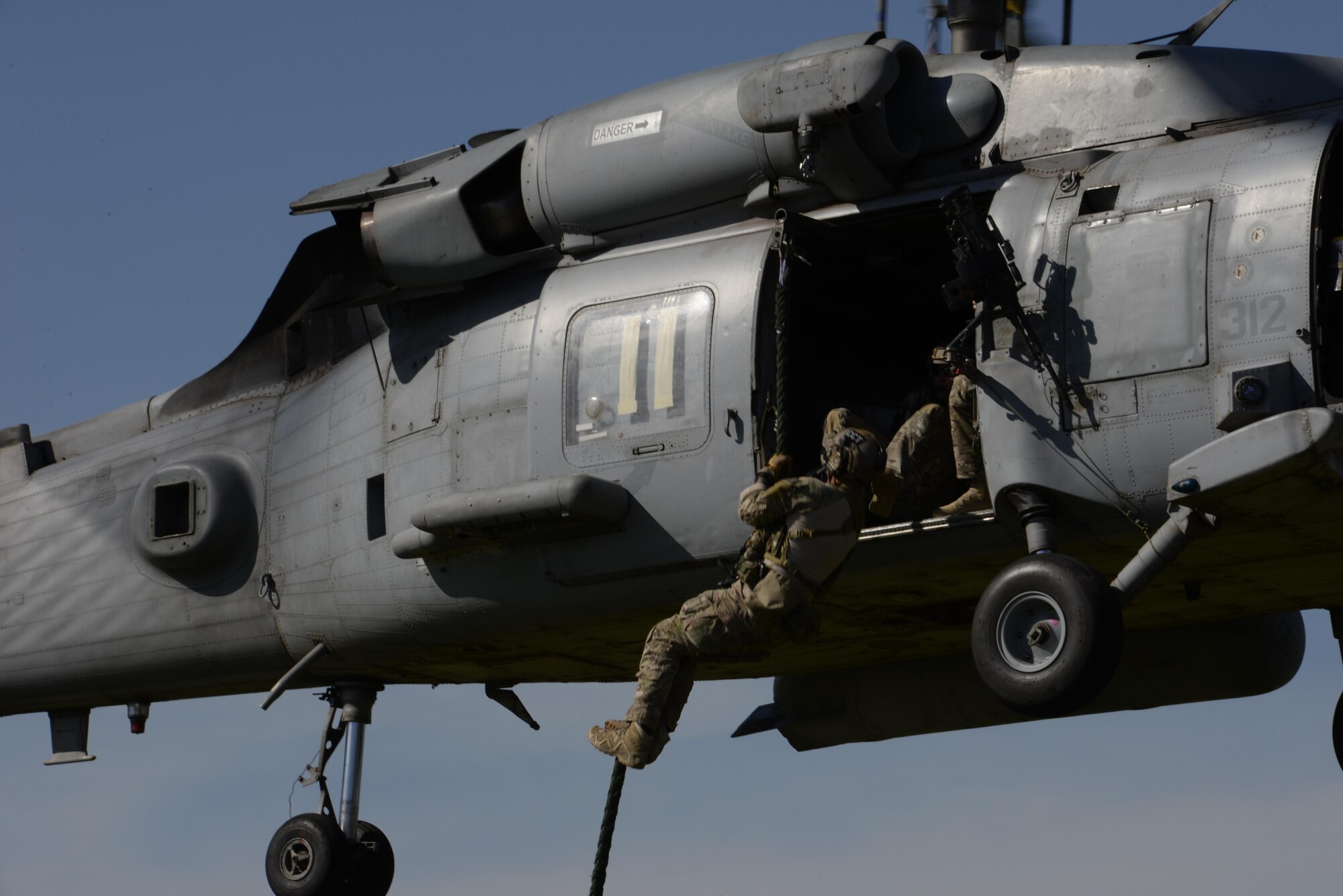 A special tactics combat controller from the 320th Special Tactics Squadron practices fast roping from a U.S. Navy 85th Helocopter Sea Combat Squadron HH-60H Seahawk during exercise Talisman Sabre in Northern Territory, Australia, July 3, 2015. Exercises like Talisman Sabre provide effective and intense training to ensure our forces are capable, interoperable and deployable on short notice. (U.S. Air Force photo by Senior Airman Stephen G. Eigel)