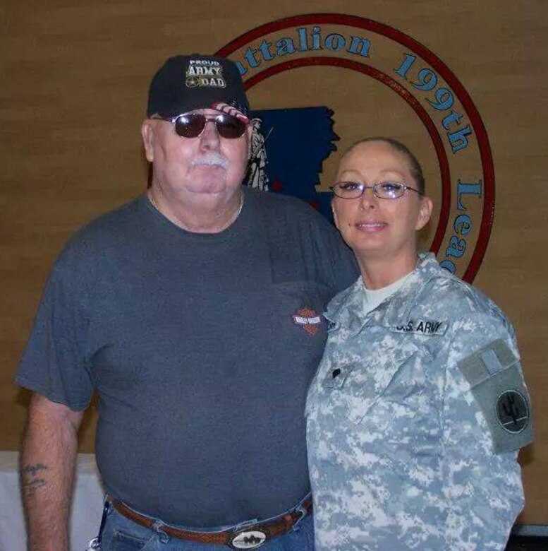 Sgt. 1st Class (Ret) James Ernest Davidson stands next to his daughter Sgt. Dawn "Michelle" Robinson. (Courtesy photo)