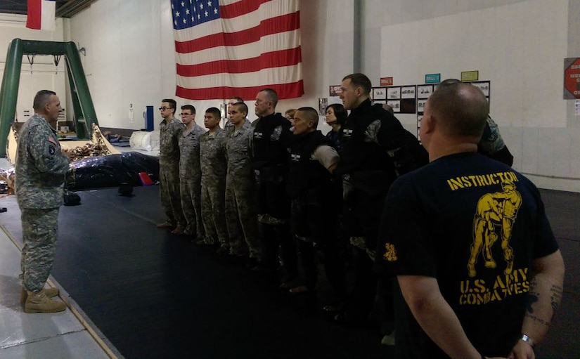Maj. Gen. John Uberti , U.S. Strategic Command chief of staff, congratulates students on a job well done after successfully completing the Modern Army Combatives Program Level 1 at Offutt Air Force Base, Neb., June 5, 2015. (U.S. Army photo by 1st Lt. Kyle Kennedy)