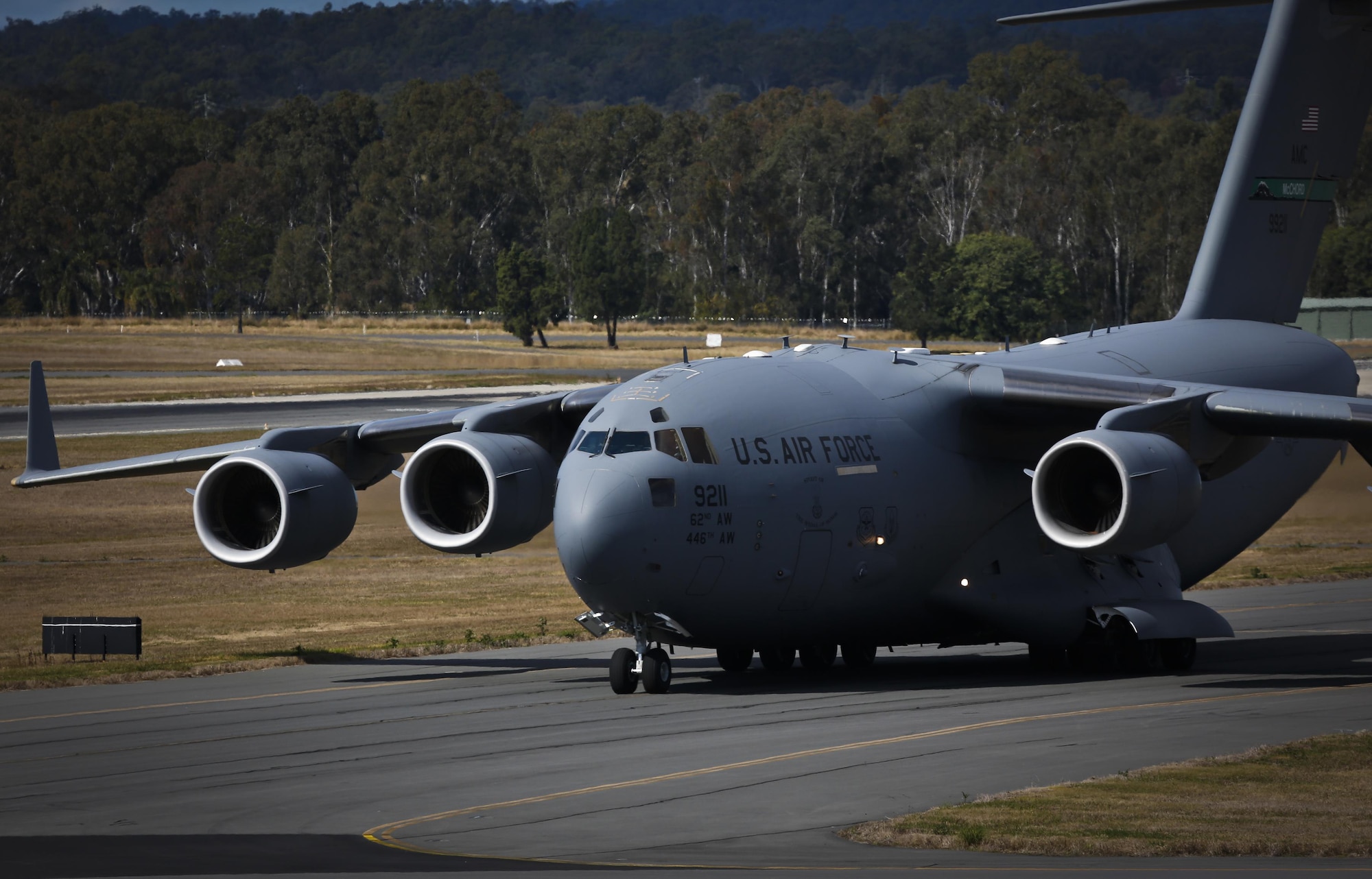 A U.S. Air Force C-17A Globemaster III taxis back to Royal Australian Air Force Base Amberley, Australia, after completing an airborne insertion with the RAAF and U.S. Army to the Shoalwater Bay Training Area, Australia, July 8, 2015. (Royal Australian Air Force photo by Cpl. Shannon McCarthy/Released)