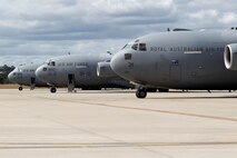 Royal Australian and U.S. Air Force C-17A Globemaster III aircraft land at RAAF Base Amberley, Australia, after an airborne insertion with the U.S. Army to the Shoalwater Bay Training Area, Australia, July 8, 2015. (Royal Australian Air Force photo by Cpl. Peter Borys/Released)
