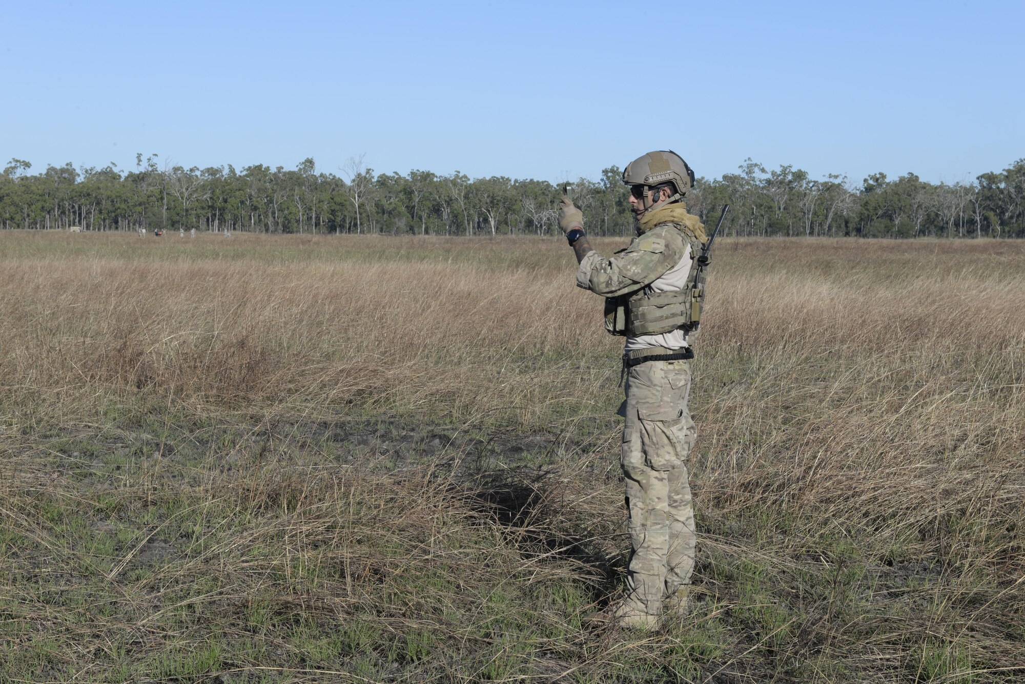 A special tactics special operations weatherman from the 320th Special Tactics Squadron plans for a static line parachute drop during exercise Talisman Sabre in Northern Territory, Australia, July 8, 2015. Exercises like Talisman Sabre provide effective and intense training to ensure our forces are capable, interoperable and deployable on short notice. (U.S. Air Force photo by Senior Airman Stephen G. Eigel)