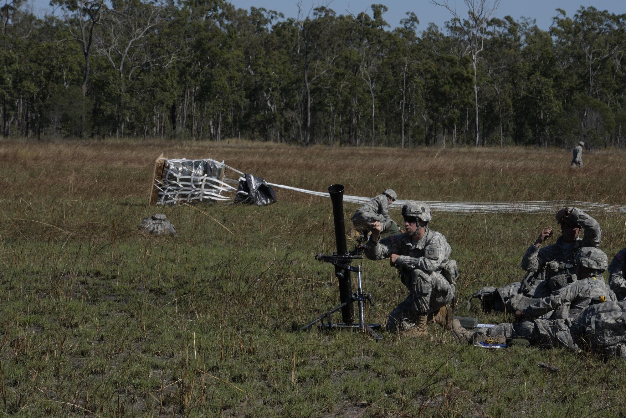 A mortarman from the U.S. Army 4th Battalion, 25th Infantry Airborne, sets up a mortar weapon after jumping from a C-17 Globemaster III aircraft during exercise Talisman Sabre in Northern Territory, Australia, July 8, 2015. Exercises such as Talisman Sabre 2015 provide realistic, relevant training which is necessary to maintain regional security, peace and stability. (U.S. Air Force photo by Senior Airman Stephen G. Eigel)