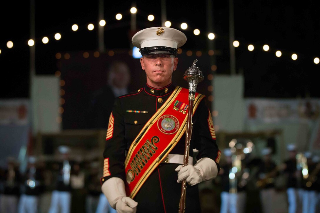 Master Gunnery Sgt. Mark Gleason, bandmaster, U.S. Marine Corps Forces, Pacific Band, marches to his spot during a military tattoo in Nuku'alofa, Tonga July 8, 2015. The MARFORPAC Band travels throughout the Pacific region to promote community relations and interoperability between the U.S. and other countries.
