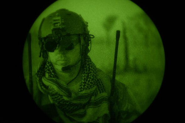 A special tactics combat controller from the 320th Special Tactics Squadron talks to his team during a personnel recovery mission during exercise Talisman Sabre in Northern Territory, Australia, July 10, 2015. Credible, ready maritime forces help to preserve peace and prevent conflict. Talisman Sabre participants have the opportunity to further enhance their ability to respond to crises as part of a joint or combined effort. (U.S. Air Force photo by Senior Airman Stephen G. Eigel)