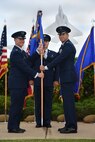 Col. Randy Huiss, 15th Wing commander, passes the 15th Medical Group guidon to Col. Christopher Paige, 15th MDG in-coming commander, during the 15th MDG change of command ceremony on Joint Base Pearl Harbor-Hickam, Hawaii, July 14, 2015. Paige comes to the 15th MDG from Maxwell Air Force Base, where he was a student at the Air War College. As the new MDG Commander, Paige will be responsible for providing medical and dental services for 14,800 beneficiaries and ensuring quality healthcare service for 90,000 outpatient visits, 22,000 dental visits, and over 125,000 pharmaceutical distributions annually. (U.S. Air Force Photo by Tech Sgt. Aaron Oelrich/Released)