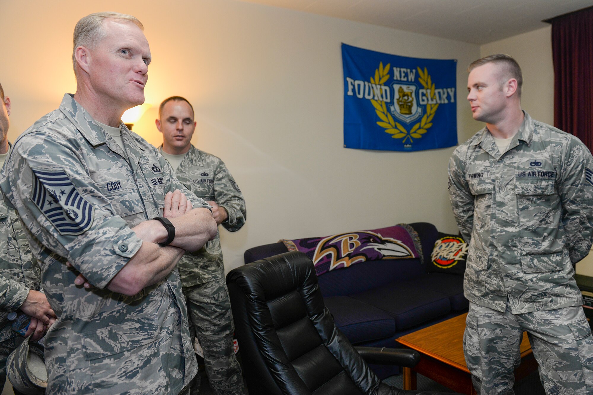 Chief Master Sgt. of the Air Force James A. Cody tours a dormitory at Yokota Air Base, Japan, July 10, 2015. During his tour of base dormitories, Cody observed housing, dayroom and laundry room facilities in order to get a firsthand perspective on what is working and what could be improved. (U.S. Air Force photo by Airman 1st Class Elizabeth Baker/Released)