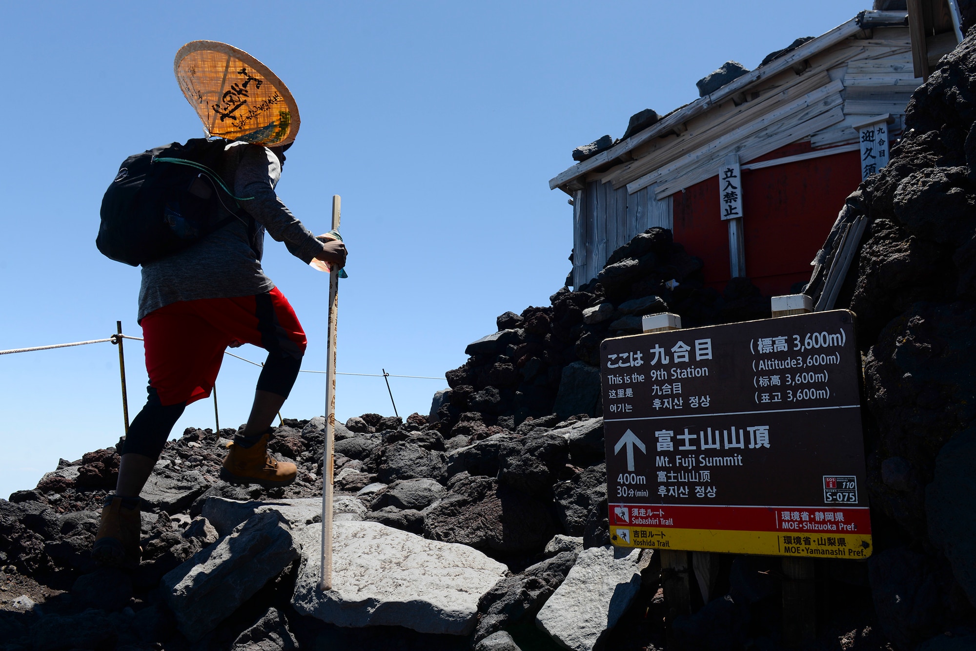 A hiker makes his way past the 9th station of Yoshida trail on Mount Fuji, Japan, July 11, 2015. To reach the summit of Mount Fuji, hikers had to climb over 5,000 ft., from the 5th station, taking anywhere from three to seven hours on average. (U.S. Air Force photo by Airman 1st Class Elizabeth Baker/Released)