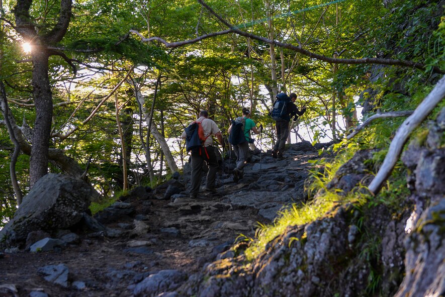 Participants of the Chief Master Sergeant of the Air Force resiliency climb of Mount Fuji, Japan, hike Yoshida trail on the way to the summit, July 11, 2015. To make sure all 86 hikers returned safely from the mountain, hikers traveled alongside a wingman, keeping each other motivated along the way. (U.S. Air Force photo by Airman 1st Class Elizabeth Baker/Released)
