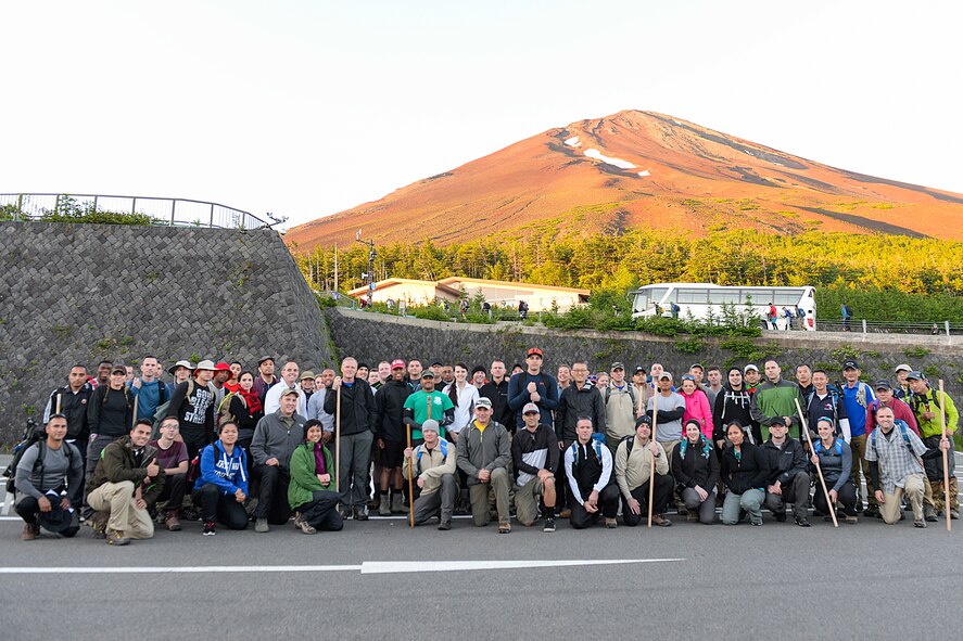 Members of Team Yokota pose with Chief Master Sergeant of the Air Force James A. Cody at the 5th station before beginning the climb to the summit of Mount Fuji, Japan, July 11, 2015. Hikers bus to the 5th station at nearly 7,000 ft. altitude before beginning the trek. (U.S. Air Force photo by Airman 1st Class Elizabeth Baker/Released)