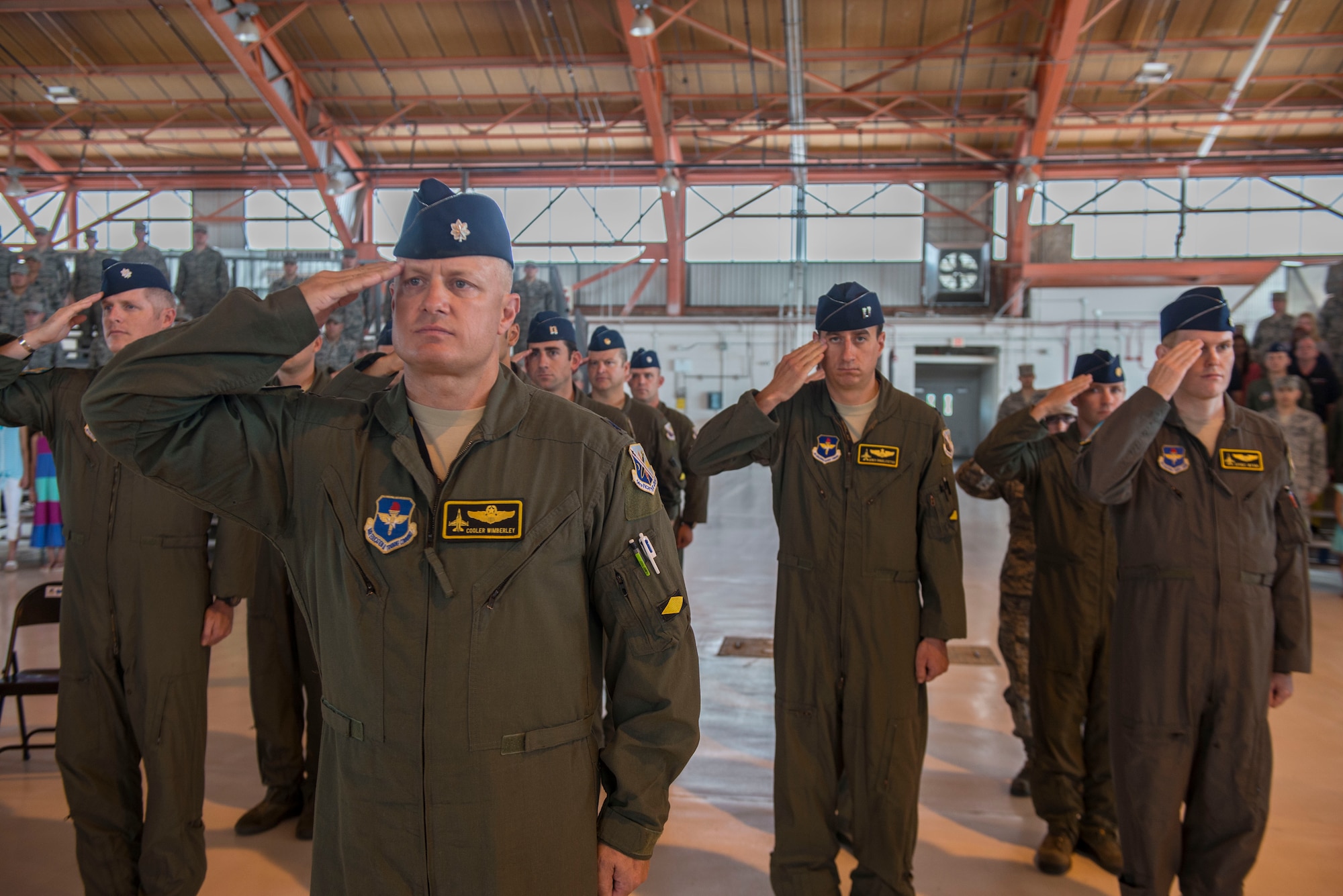 Members of the 314th Fighter Squadron salute the flag while the national anthem plays as part of the 314th FS activation ceremony at Holloman Air Force Base, N.M., on July 14. The 54th Fighter Group, a detachment of the 56th Fighter Wing at Luke Air Force Base, Ariz., activated the 314th Fighter Squadron here. The activation is meant to produce the world’s greatest F-16 Fighting Falcon pilots and deploy combat mission-ready Airmen to units worldwide. (U.S. Air Force photo by Senior Airman Aaron Montoya)