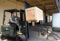 U.S. Air Force Airman 1st Class Cody Masterson, 23d Logistics Readiness Squadron material management apprentice, delivers HC-130J Combat King II parts shipment to the base Traffic Management Office July 8, 2015, at Moody Air Force Base, Ga. The 23d LRS warehouse 17 parts store members receive and process property for TMO to transport. (U.S. Air Force photo by Airman Greg Nash/Released)
