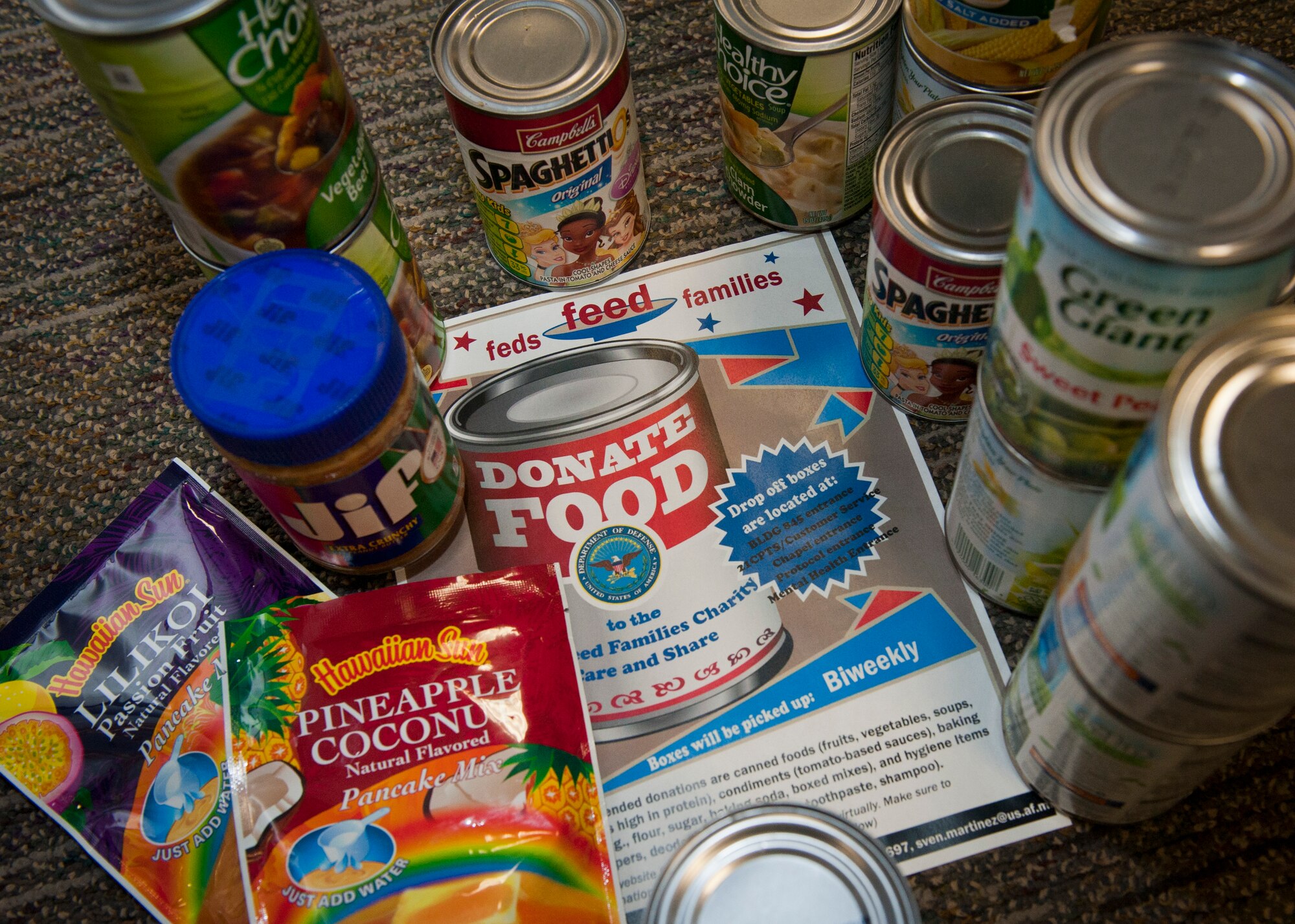 PETERSON AIR FORCE BASE, Colo. – A pile of donated food items wait to be picked up at one of the many donation sites across base, July 14, 2015. The donated food items are part of the nationwide Feds Feed Families campaign, which began in 2009 and joins federal employees across the United States in an effort to stamp out hunger. For the 21st Space Wing, donations will be sent to the Care and Share Food Bank in Colorado Springs to support and give back to the local community. The campaign continues through Aug. 31. (U.S. Air Force photo by Airman 1st Class Rose Gudex)