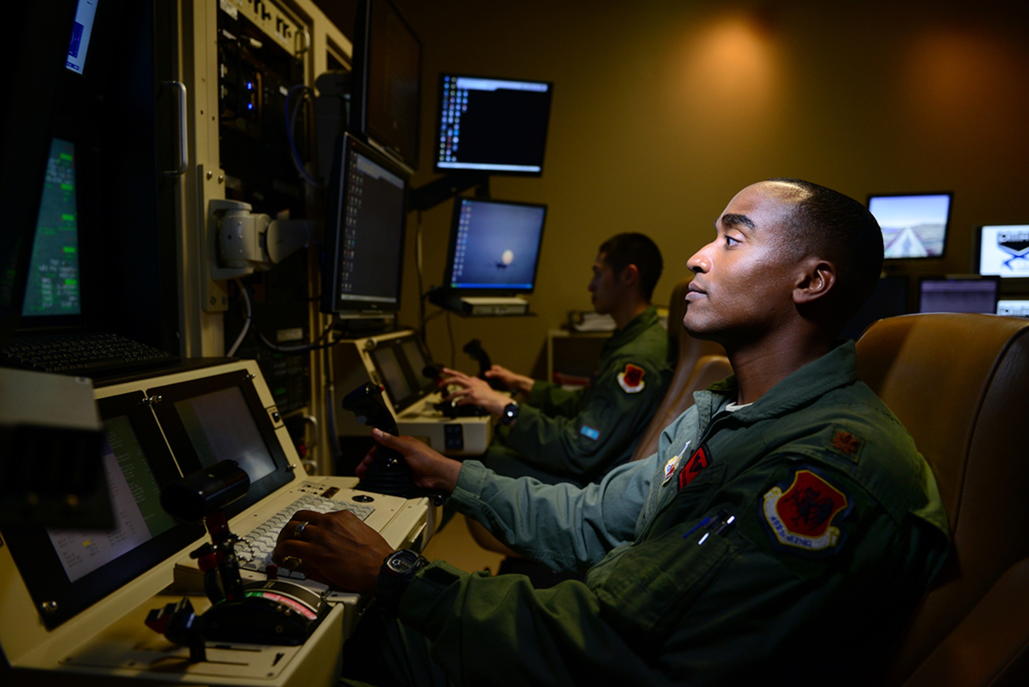 Maj. Bishane, a 432nd Aircraft Maintenance Squadron MQ-9 Reaper pilot, controls an aircraft from Creech Air Force Base, Nevada. Remotely piloted aircraft pilots work closely with intelligence officers, sensor operators and maintainers to complete mission objectives. RPA personnel deal with the stressors of a deployed military service member while maintaining the normalcy of a day-to-day life through programs designed to enhance communication skills, family and spiritual growth. (U.S. Air Force photo by Staff Sgt. Vernon Young Jr.)