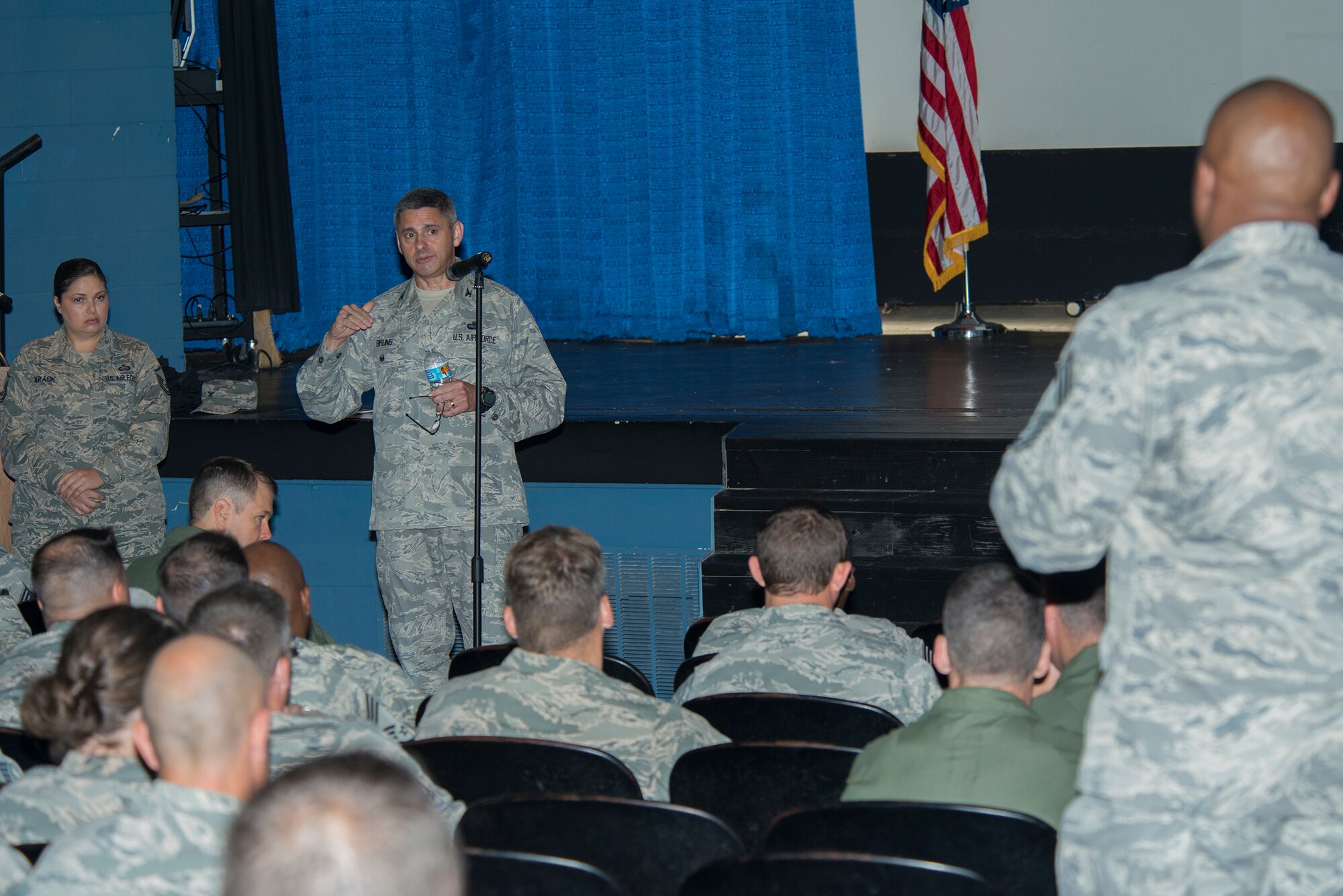 U.S. Air Force Col. Archibald Bruns, Air Force Personnel Center director of personnel services, briefs Team Moody members during the Enlisted Evaluation System Roadshow’s all-call July 13, 2015, at Moody Air Force Base, Ga. The team began traveling in June 2015 and will travel to 91 bases to ensure Airmen are aware of the changes to the enlisted evaluation report system. (U.S. Air Force photo by Airman 1st Class Ceaira Tinsley/Released)