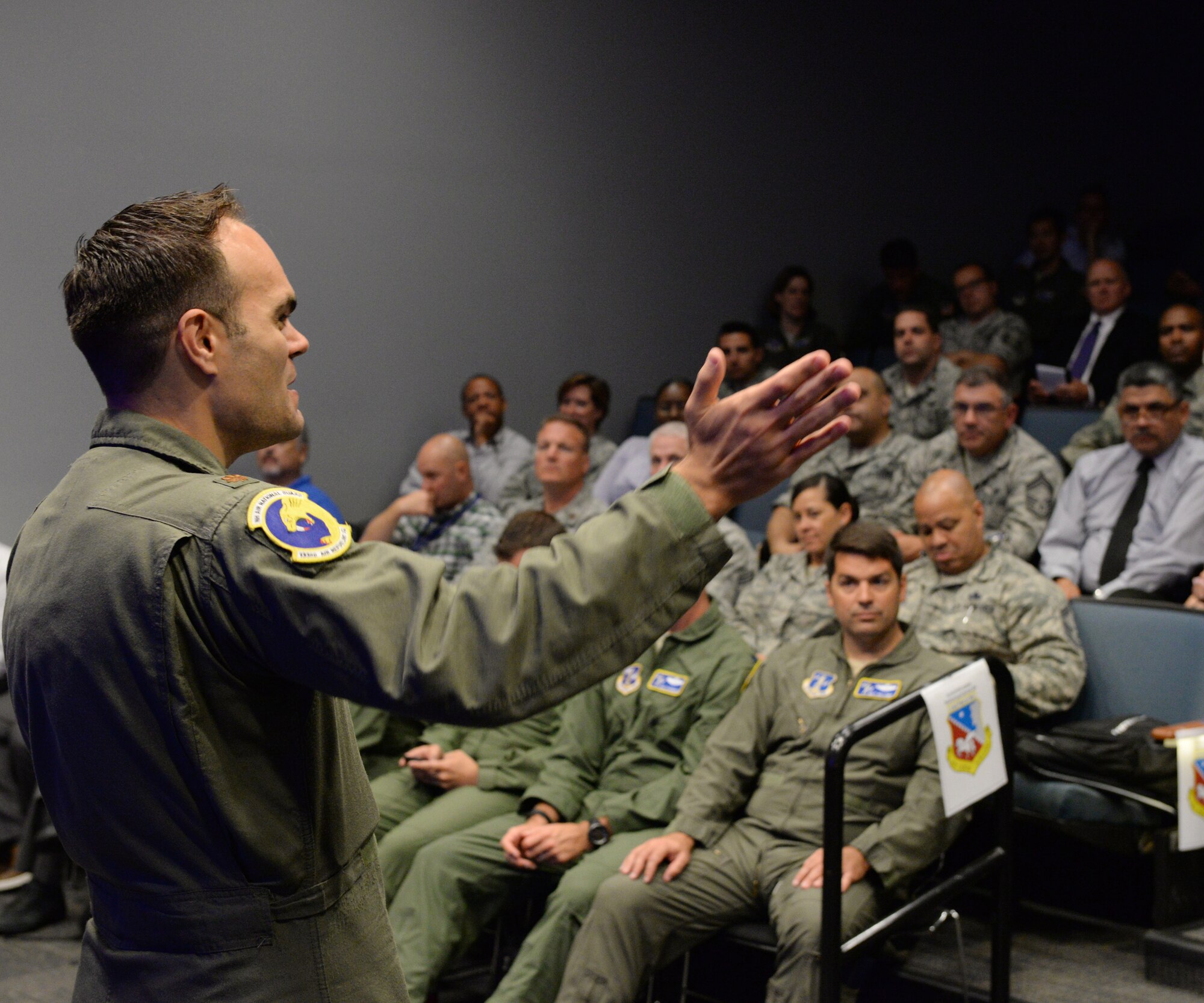N.H. Air National Guard Maj. Michael J.  Sanders, KC-46 program integration officer, speaks to audience members during the KC-46 Site Activation Task Force visit at Pease Air National Guard Base, N.H., July 14, 2015.  Subject matter experts from the National Guard Bureau, Air Mobility Command, KC-46 Systems Program Office, Boeing, Flight Safety, McConnell Air Force Base and Altus AFB are on hand to help field the KC-46 at Pease. (N.H. Air National Guard photo by Staff Sgt. Curtis J. Lenz)
