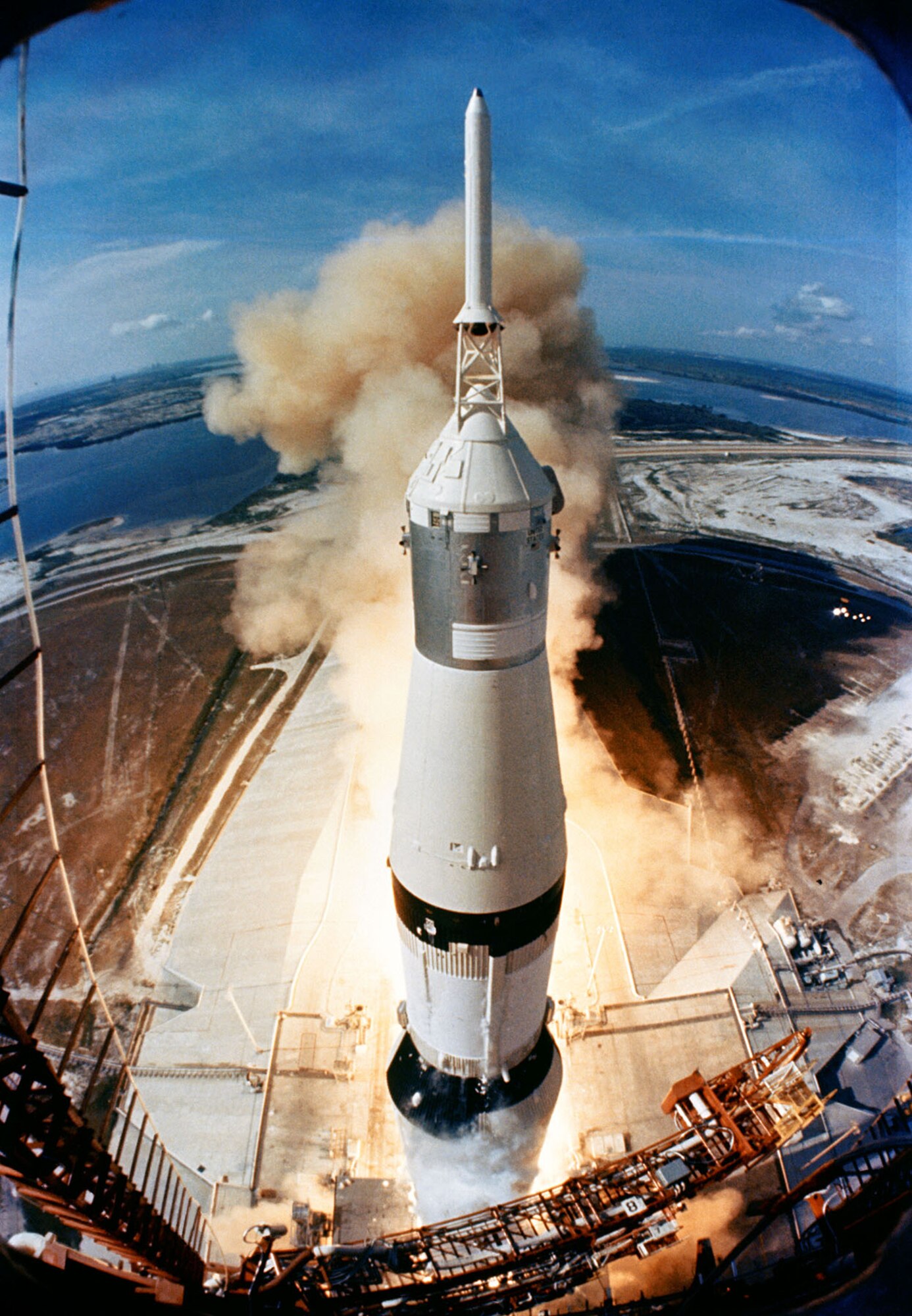 Smoke and flames signal the opening of a historic journey as the Saturn V clears the launch pad at the Kennedy Space Center on July 16, 1969. (NASA photo)