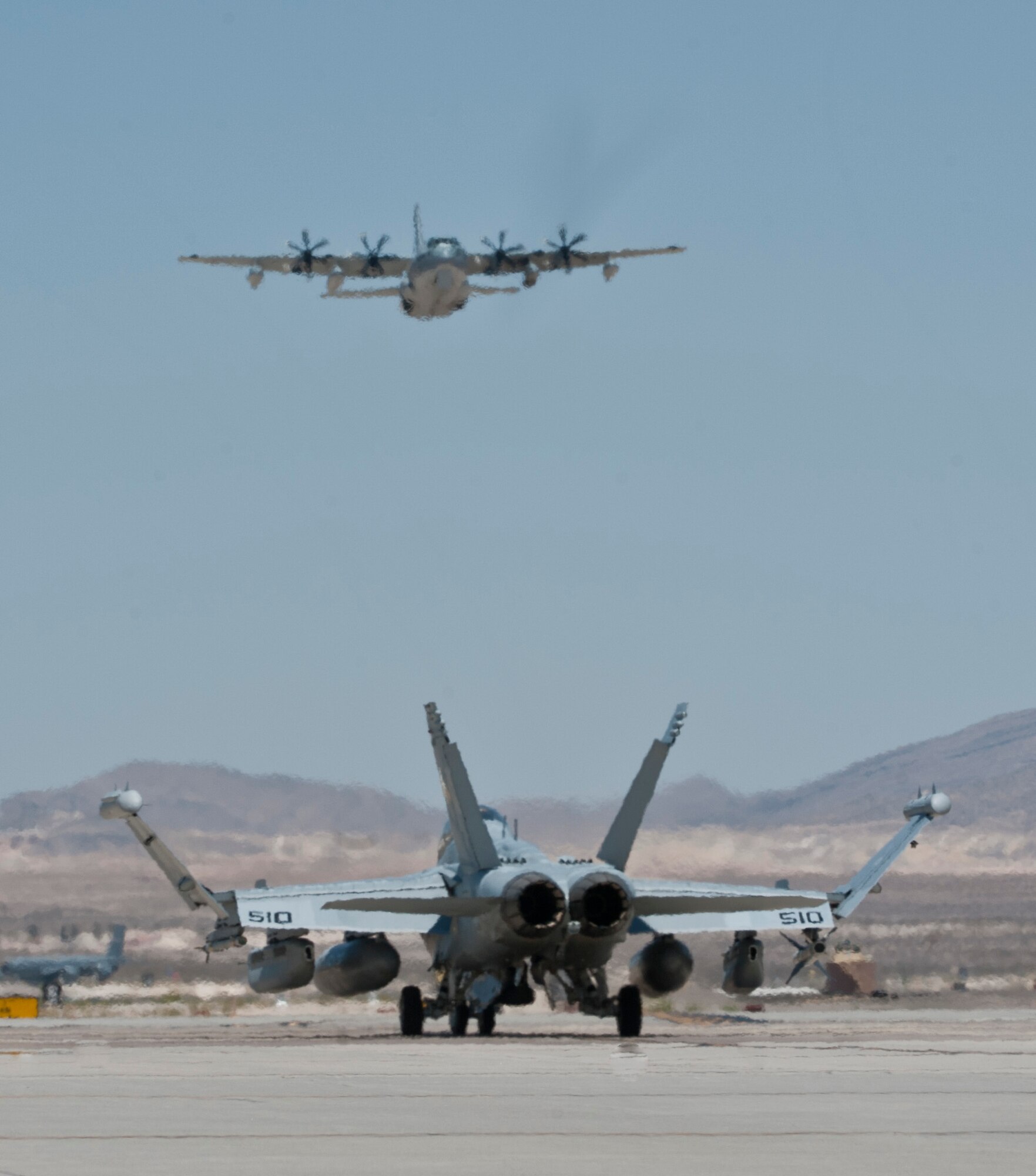 An EA-18G Growler taxis down the flightline during Red Flag 15-03 at Nellis Air Force Base, Nev., July 13, 2015. Since its establishment in 1975, Red Flag participants have used the 2.9 million acre Nevada Test and Training Range as a one-of-a-kind arena for realistic air combat training. (U.S. Air Force photo by Airman 1st Class Jake Carter)