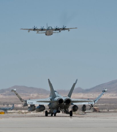 An EA-18G Growler taxis down the flightline during Red Flag 15-03 at Nellis Air Force Base, Nev., July 13, 2015. Since its establishment in 1975, Red Flag participants have used the 2.9 million acre Nevada Test and Training Range as a one-of-a-kind arena for realistic air combat training. (U.S. Air Force photo by Airman 1st Class Jake Carter)