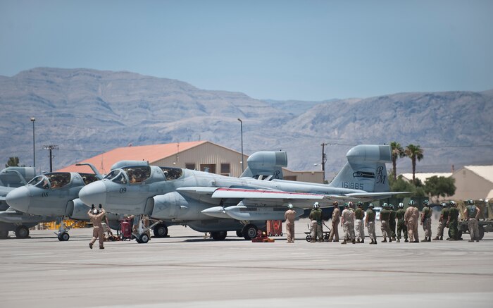 Members of Marine Tactical Electronic Warfare Squadron 4, Marine Corps Air Station Cherry Point, N.C., gather around an EA-6B Prowler prior to a Red Flag 15-3 sortie at Nellis Air Force Base, Nev., July 13, 2015. Various units from around the Air Force, joint branches and coalition partners converge on Nellis AFB three to four times a year to take part in the exercise, which simulates large-scale live, virtual and constructive warfare. (U.S. Air Force photo by Staff Sgt. Siuta B. Ika)