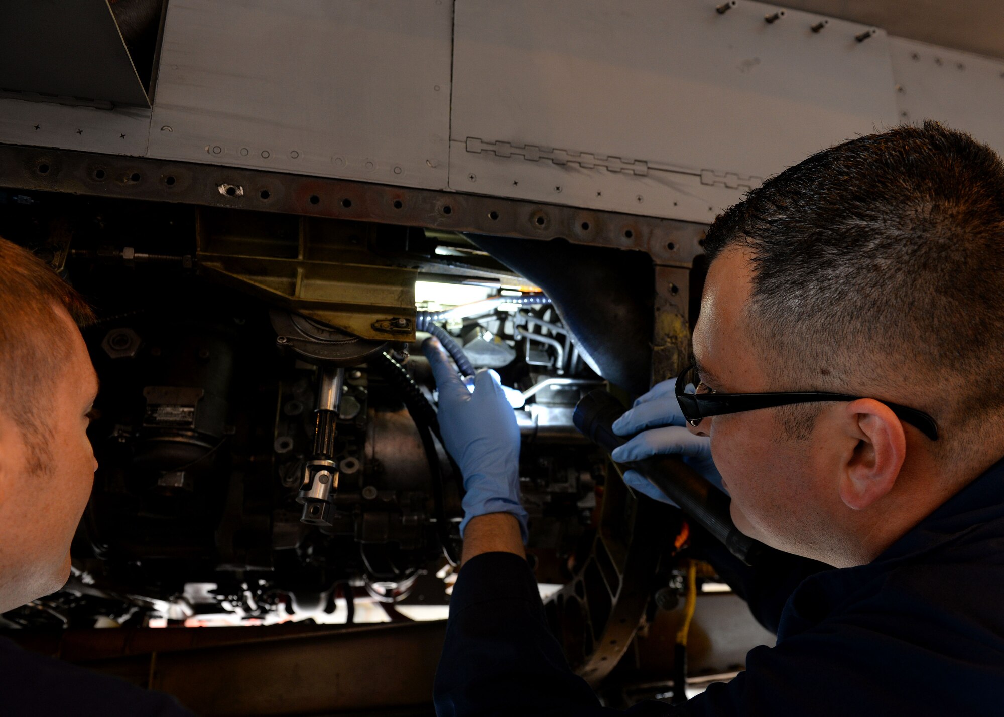 U.S. Air Force Staff Sgt. Angel Gonzalez, 31st Maintenance Squadron aerospace propulsion craftsman, inspects F-16 Fighting Falcon engine components, June 15, 2015, at Aviano Air Base, Italy. Gonzalez worked with phase crew chiefs to ensure the integrity of an F-16 engine after it reached 400 flying hours. (U.S. Air Force photo by Airman 1st Class Cary Smith/Released)