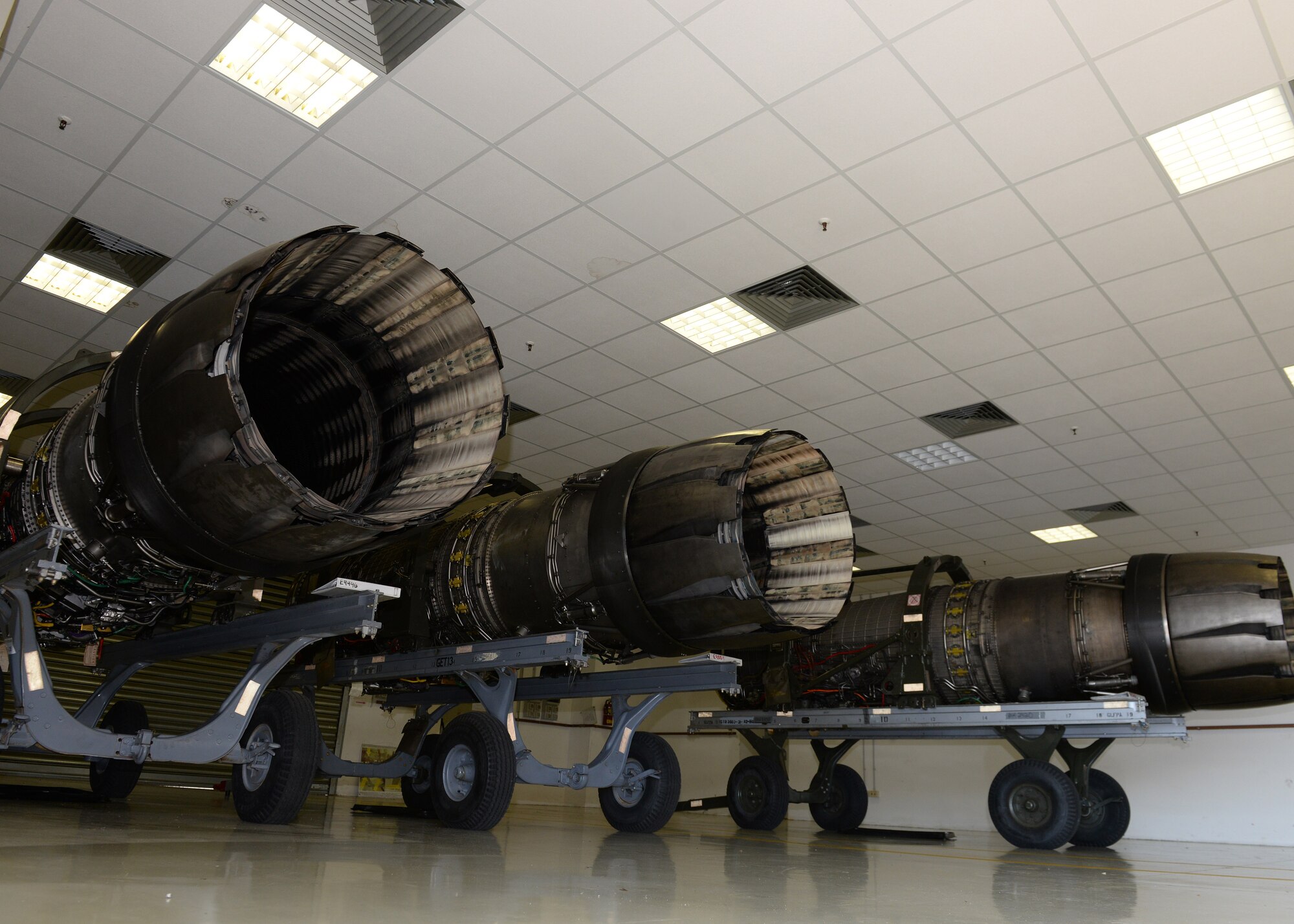 Repaired F-16 Fighting Falcon engines sit on engine trailers inside the 31st Maintenance Squadron engine propulsion shop, June 24, 2015, at Aviano Air Base, Italy. The 31 MXS propulsion shop is comprised of three Airmen who provide support to Aviano’s mission by inspecting and delivering engines, assisting phase and flightline crew chiefs, and maintaining engine trailers. (U.S. Air Force photo by Airman 1st Class Cary Smith/Released)