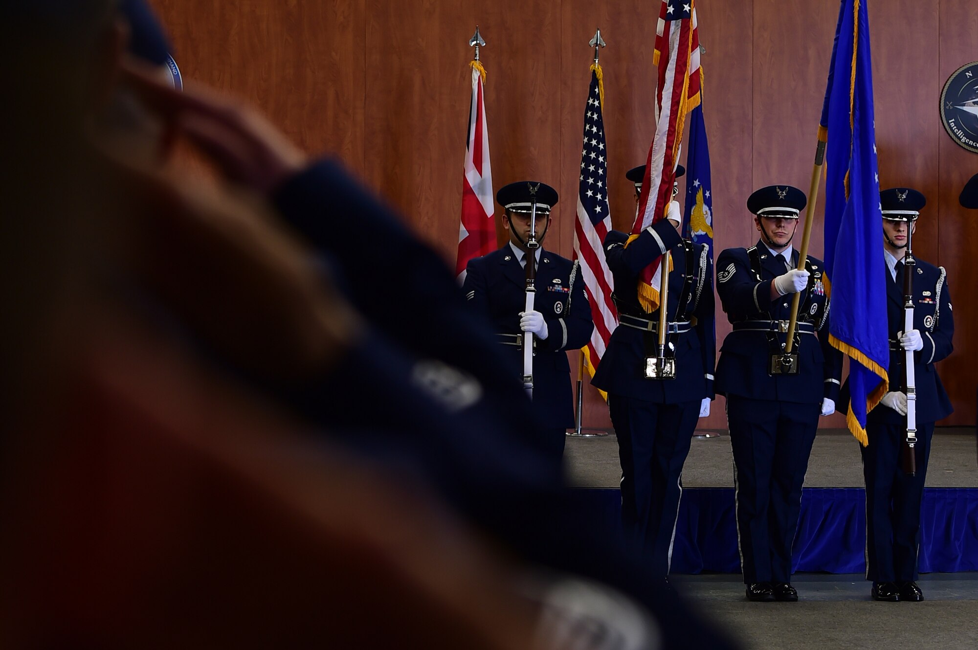 Airmen from the 501st Combat Support Wing render a salute as the colors are presented during the 423rd Air Base Group change of command ceremony where Col. Young Yu, accepted command of the 423rd ABG from Col. Steven Sweeney at RAF Molesworth, United Kingdom, July 14, 2015. (U.S. Air Force photo by Tech. Sgt. Chrissy Best/Released)