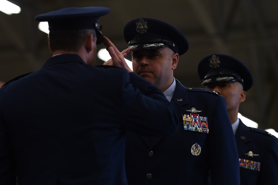 Col. Steven Sweeney, center, renders a salute to Col. Kevin Cullen, 501st Combat Support Wing commander, after relinquishing command of the 423rd Air Base Group during a ceremony at RAF Molesworth, United Kingdom, July 14, 2015. Following the salute, Cullen passed the command to Col. Young Yu. (U.S. Air Force photo by Staff Sgt. Jarad A. Denton/Released)