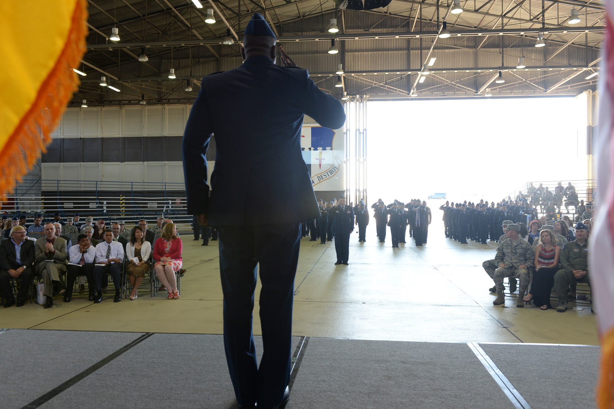 U.S. Air Force Col. Alfred Flowers, 52nd Medical Group commander, salutes his group for the first time as their commander during the 52nd MDG's change of command ceremony at Hangar One on Spangdahlem Air Base, Germany, July 10, 2015. Flowers previously served as chief of the medical support operations division, Air Force Medical Support Agency, Office of the Air Force Surgeon General, at the Defense Health Headquarters, Falls Church, Virginia. (U.S. Air Force photo by Staff Sgt. Joe W. McFadden/Released)