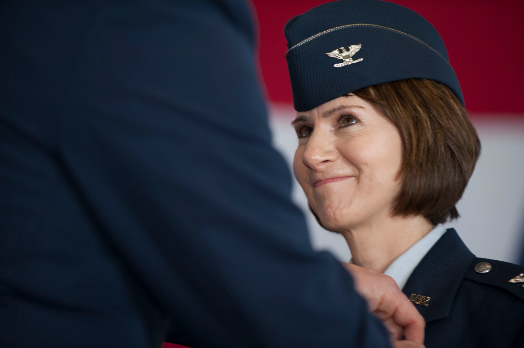 U.S. Air Force Col. Jill Scheckel, outgoing 52nd Medical Group commander, receives the Legion of Merit medal from U.S. Air Force Col. Joe McFall, 52nd Fighter Wing commander, during the 52nd MDG change of command ceremony at Hangar One on Spangdahlem Air Base, Germany, July 10, 2015. Scheckel served as commander of the group for two years before relinquishing command to U.S. Air Force Col. Alfred Flowers. (U.S. Air Force photo by Airman 1st Class Timothy Kim/Released)