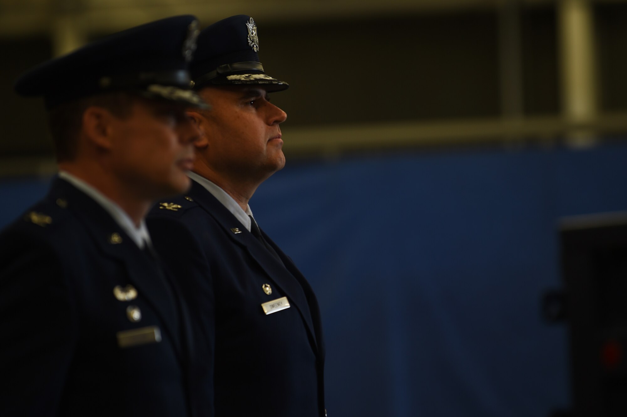 Col. Kevin Cullen, 501st Combat Support Wing commander, left, stands at attention with Col. Steven Sweeney, 423rd Air Base Group commander, right, during the group change of command ceremony at RAF Molesworth, United Kingdom, July 14, 2015. During the ceremony, Sweeney relinquished command of the 423rd ABG to Col. Young Yu. (U.S. Air Force photo by Staff Sgt. Jarad A. Denton/Released)