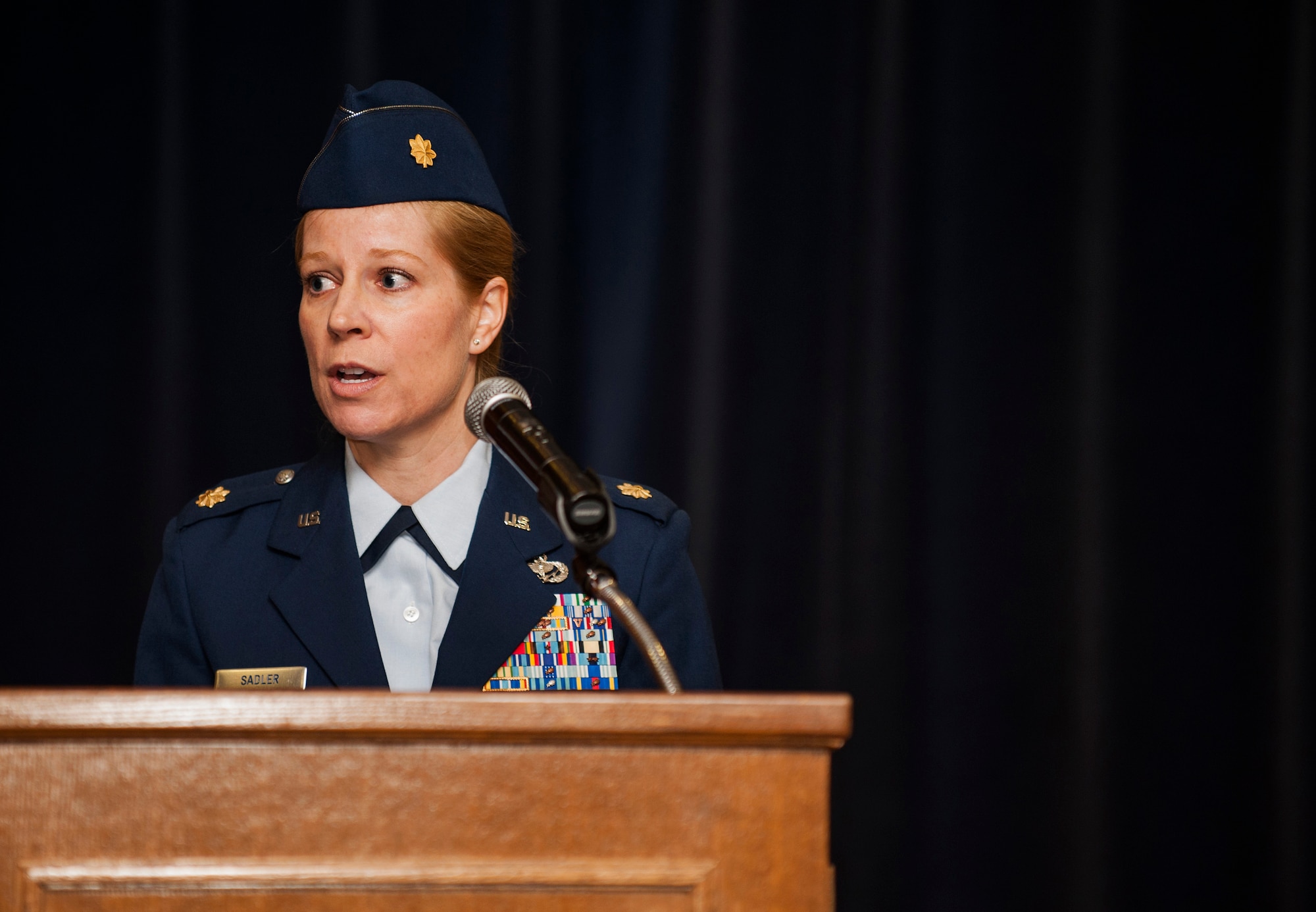 U.S. Air Force Maj. Rebecca Sadler, incoming 52nd Force Support Squadron commander, speaks during the 52nd FSS Change of Command Ceremony in Club Eifel on Spangdahlem Air Base, Germany, July 9, 2015. Sadler assumed command from former commander, U.S. Air Force Lt. Col. Elizabeth Johnston. (U.S. Air Force photo by Airman 1st Class Timothy Kim/Released)