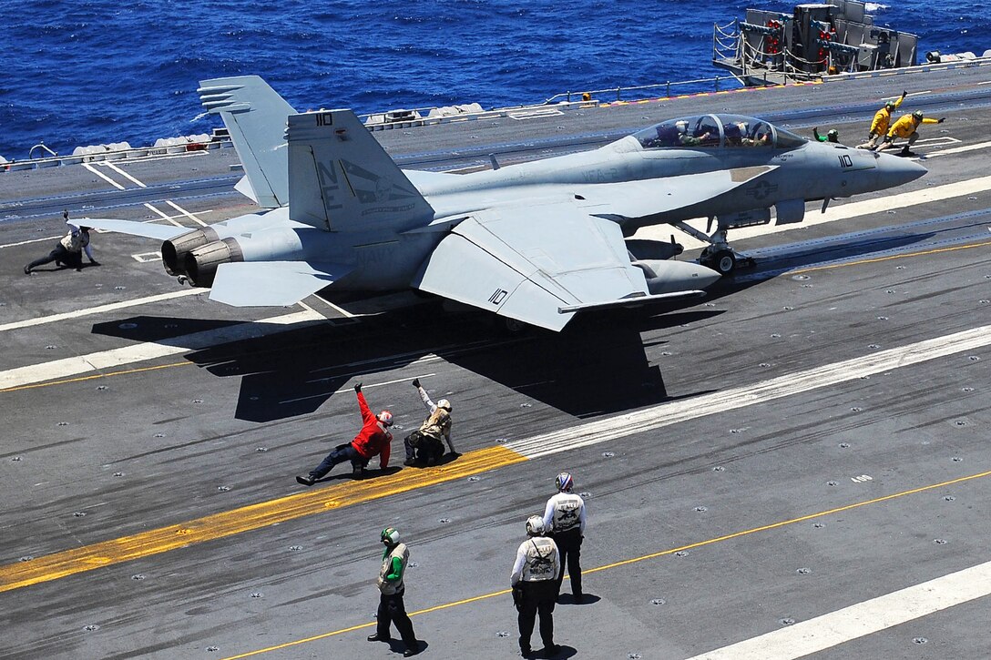 U.S. Navy sailors launch an F/A-18F Super Hornet, assigned to Strike Fighter Squadron 2, from the flight deck of the aircraft carrier USS Ronald Reagan in the Pacific Ocean, July 8, 2015. The Ronald Reagan is underway off the coast of southern California. 