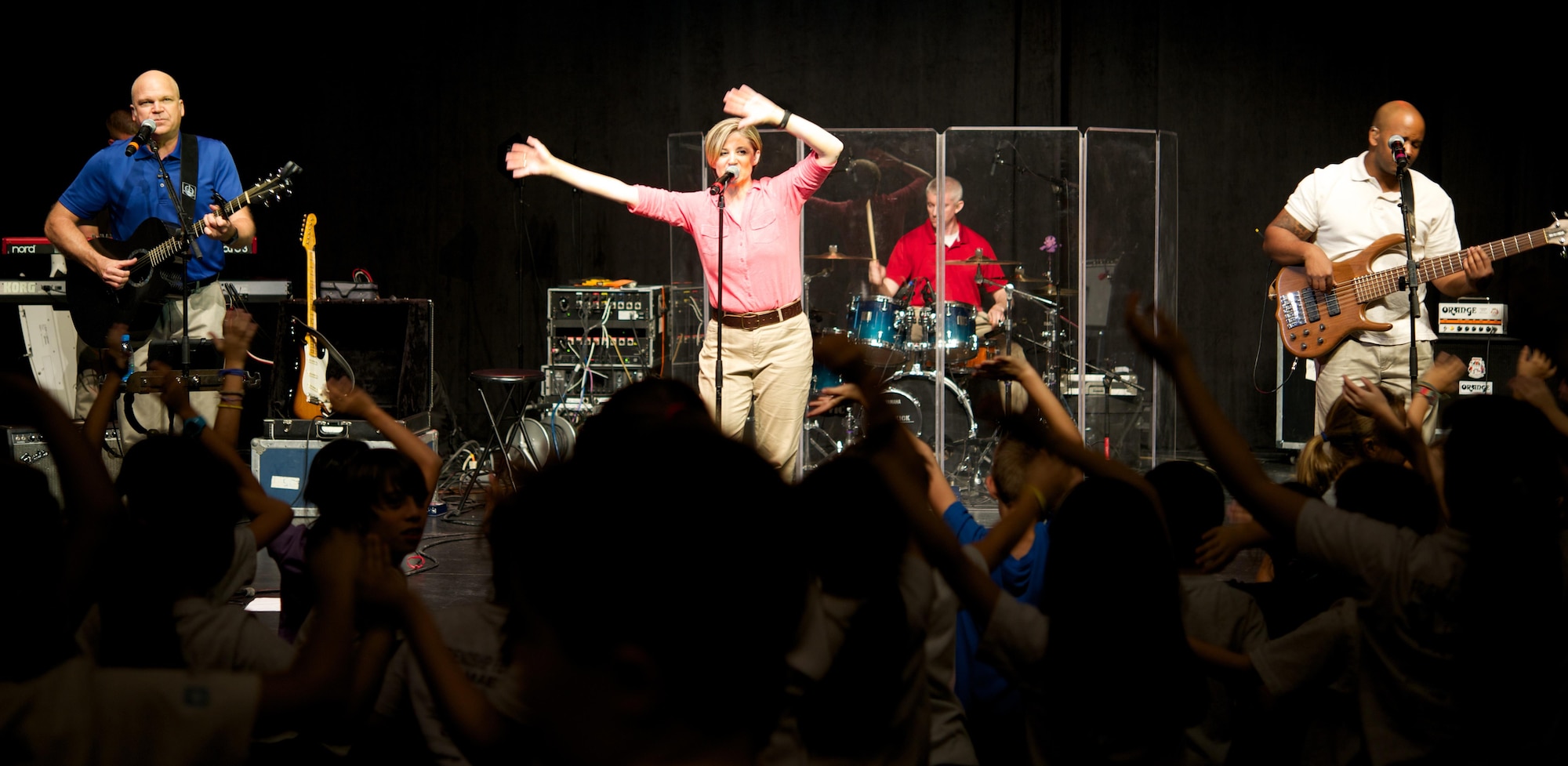 The Air Forces Central Command band plays music during a performance at the American School of Doha in Doha, Qatar, June 3, 2015. The band performed for school children, which allowed them to entertain children and support music education in partner countries. (U.S. Air Force photo by Airman 1st Class Nathan Martin/Released)