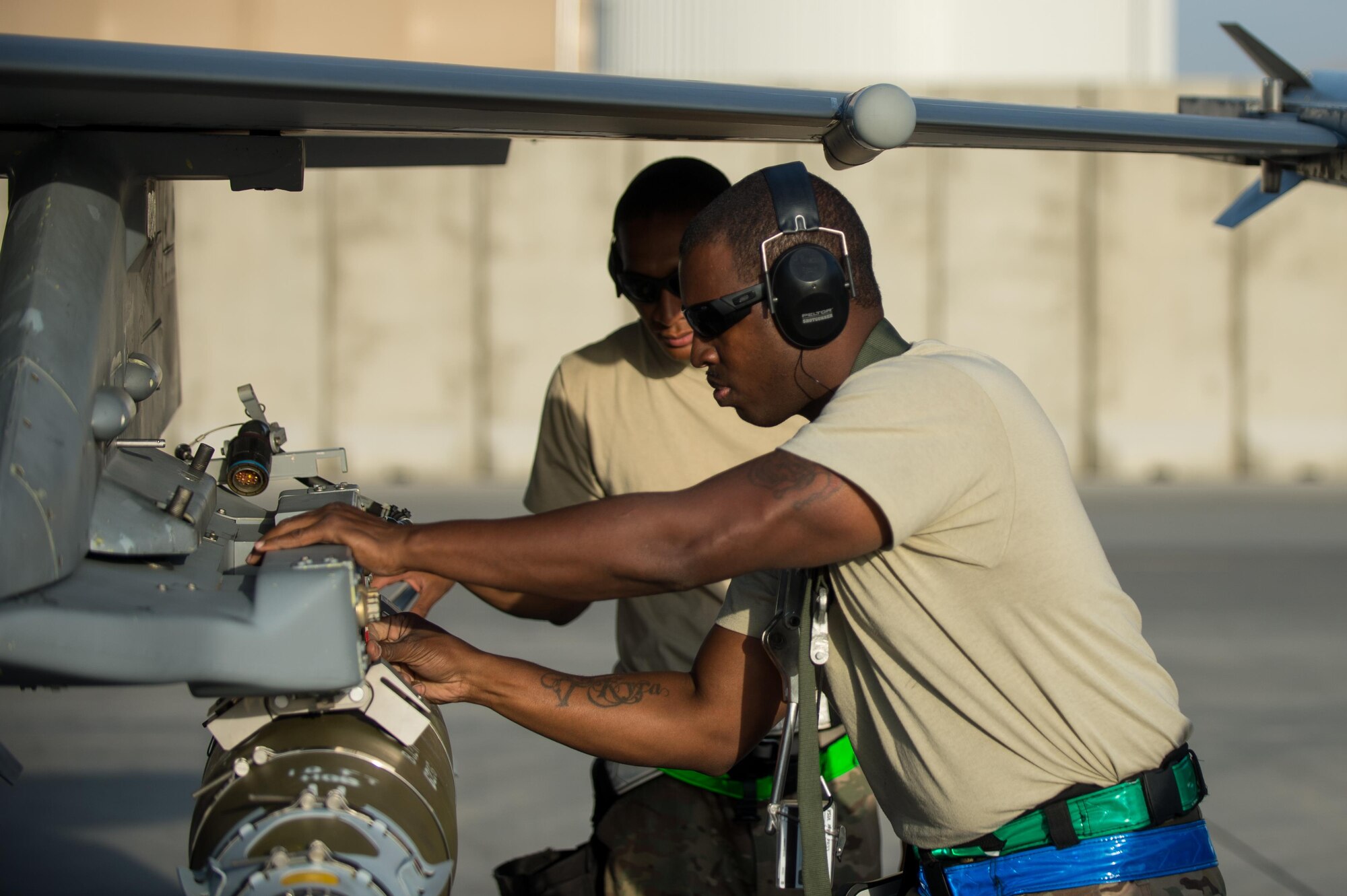 U.S. Air Force Tech. Sgt. Harrison Ragin, 455th Expeditionary Aircraft Maintenance Squadron weapons load crew chief, loads munitions onto an F-16 Fighting Falcon aircraft at Bagram Airfield, Afghanistan, July 13, 2015. The F-16 is a multi-role fighter aircraft that is highly maneuverable and has proven itself in air-to-air and air-to-ground combat. Members of the Triple Nickel are deployed in support of Operation Freedom’s Sentinel and NATO’s Resolute Support mission. (U.S. Air Force photo by Tech. Sgt. Joseph Swafford/Released)