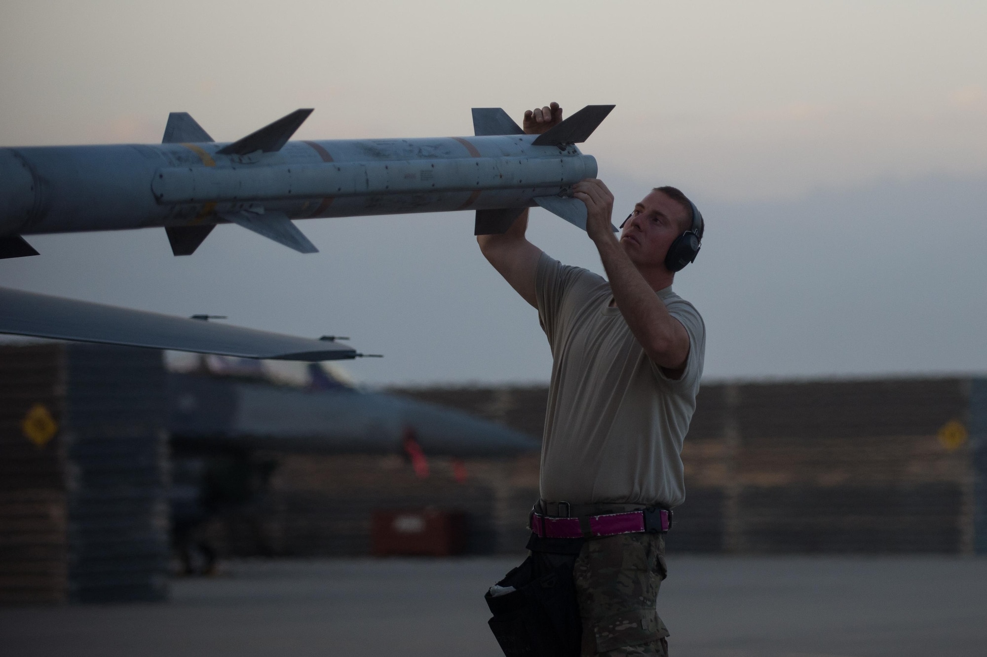 U.S. Air Force Staff Sgt. Joshua Chapman, 455th Expeditionary Aircraft Maintenance Squadron weapons flight, completes a final check of the weapons on an F-16 Fighting Falcon aircraft before it takes off on a combat sortie from Bagram Airfield, Afghanistan, July 14, 2015. The F-16 is a multi-role fighter aircraft that is highly maneuverable and has proven itself in air-to-air and air-to-ground combat. Members of the Triple Nickel are deployed in support of Operation Freedom’s Sentinel and NATO’s Resolute Support mission. (U.S. Air Force photo by Tech. Sgt. Joseph Swafford/Released)