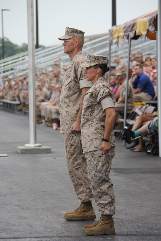Col. Harold Van Opdorp, left, relinquishes command to Col. Julie Nethercot at Officer Candidate School, July 8, at Brown Field, aboard Marine Corps Base Quantico.