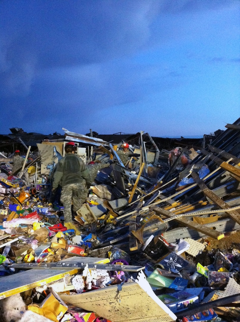 Missouri National Guard Soldiers with the 117th Engineer Team work search and
rescue missions in Joplin, Mo., just hours after a deadly tornado passed
through on Sunday. (Missouri National Guard photo by Ann Keyes) (Released)