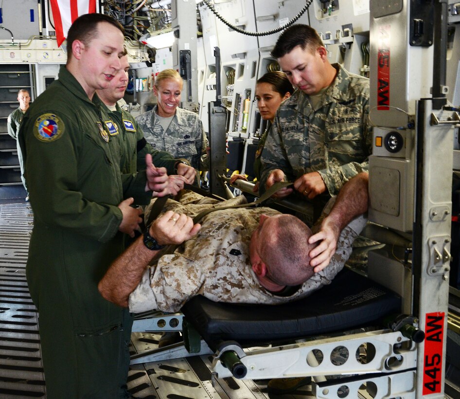 ,  – Marine Corps Sgt. Maj. Bryan B. Battaglia, the senior enlisted advisor to the chairman of the Joint Chiefs of Staff, participates as a patient during a training scenario run by the 445th Aeromedical Evacuation Squadron, during his visit to the 445th Airlift Wing July 11, 2015. While at the wing, Battaglia toured a C-17 Globemaster III, participated in demonstrations by the 445th AE and Aeromedical Staging Squadrons and watched the 87th Aerial Port Squadron load cargo on the aircraft during a training scenario. (U.S. Air Force photo/Senior Airman Joel McCullough)
